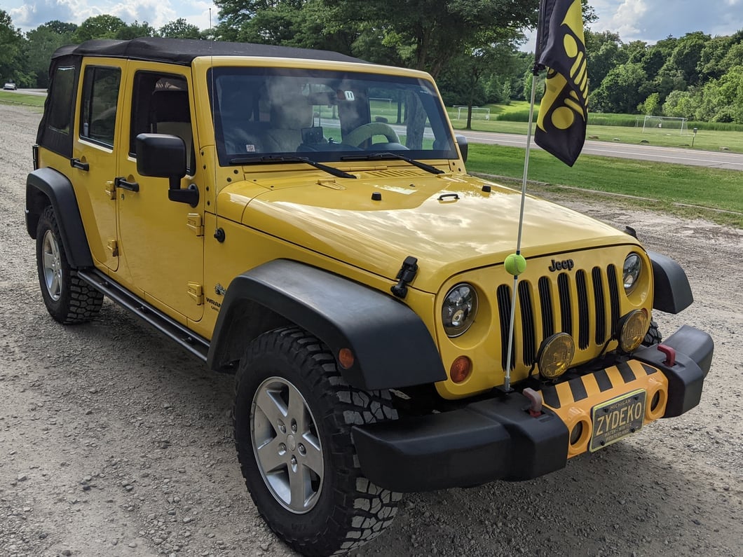 Jeep Licensed by RedRock 3-Inch Round Curved Side Step Bars with Jeep Logo; Textured Black (07-18 Jeep Wrangler JK 4-Door)