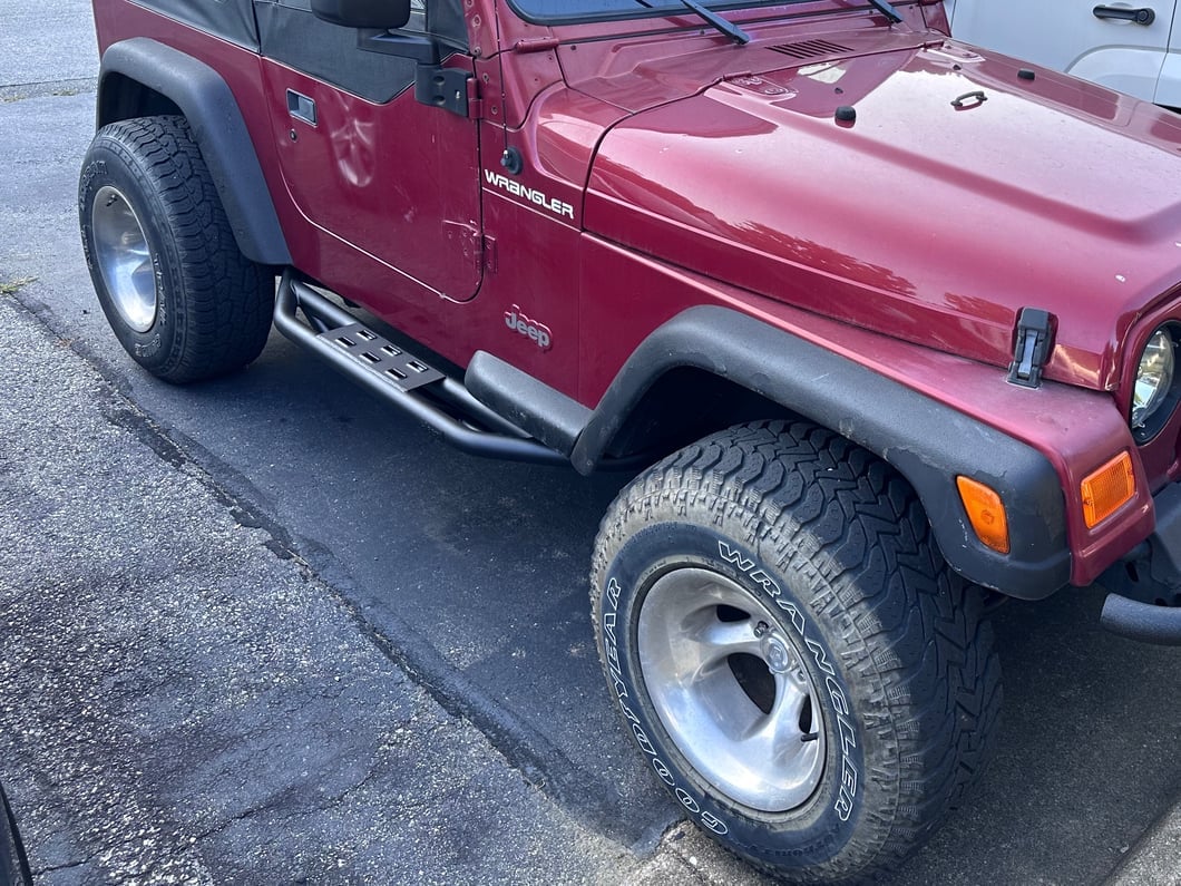 Jeep Licensed by RedRock Side Armor with Step Pads with Jeep Logo; Textured Black (87-06 Jeep Wrangler YJ & TJ, Excluding Unlimited)