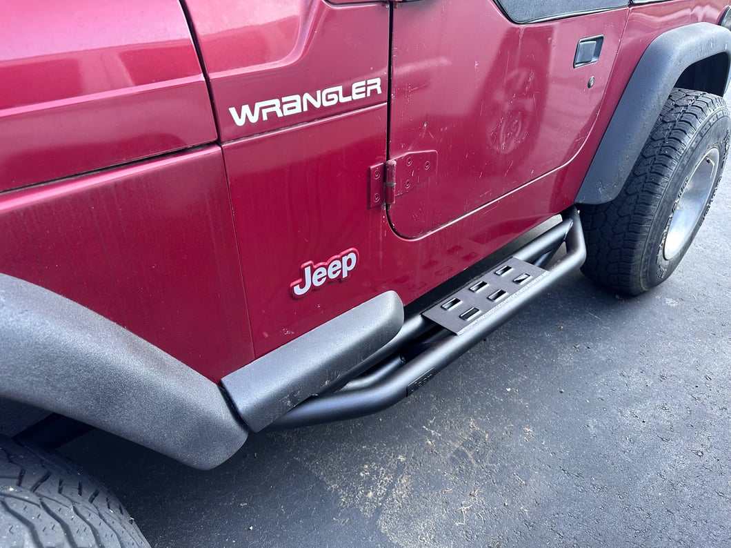 Jeep Licensed by RedRock Side Armor with Step Pads with Jeep Logo; Textured Black (87-06 Jeep Wrangler YJ & TJ, Excluding Unlimited)
