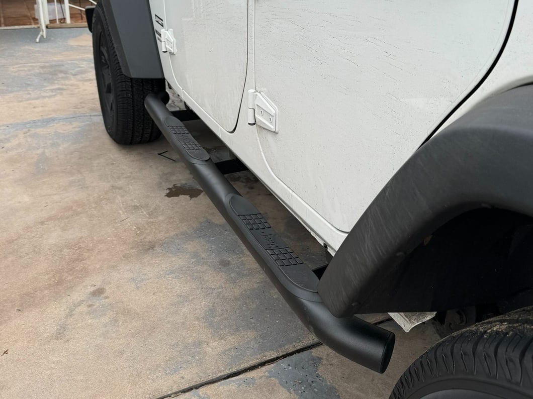 Jeep Licensed by RedRock 3-Inch Round Curved Side Step Bars with Jeep Logo; Textured Black (07-18 Jeep Wrangler JK 4-Door)