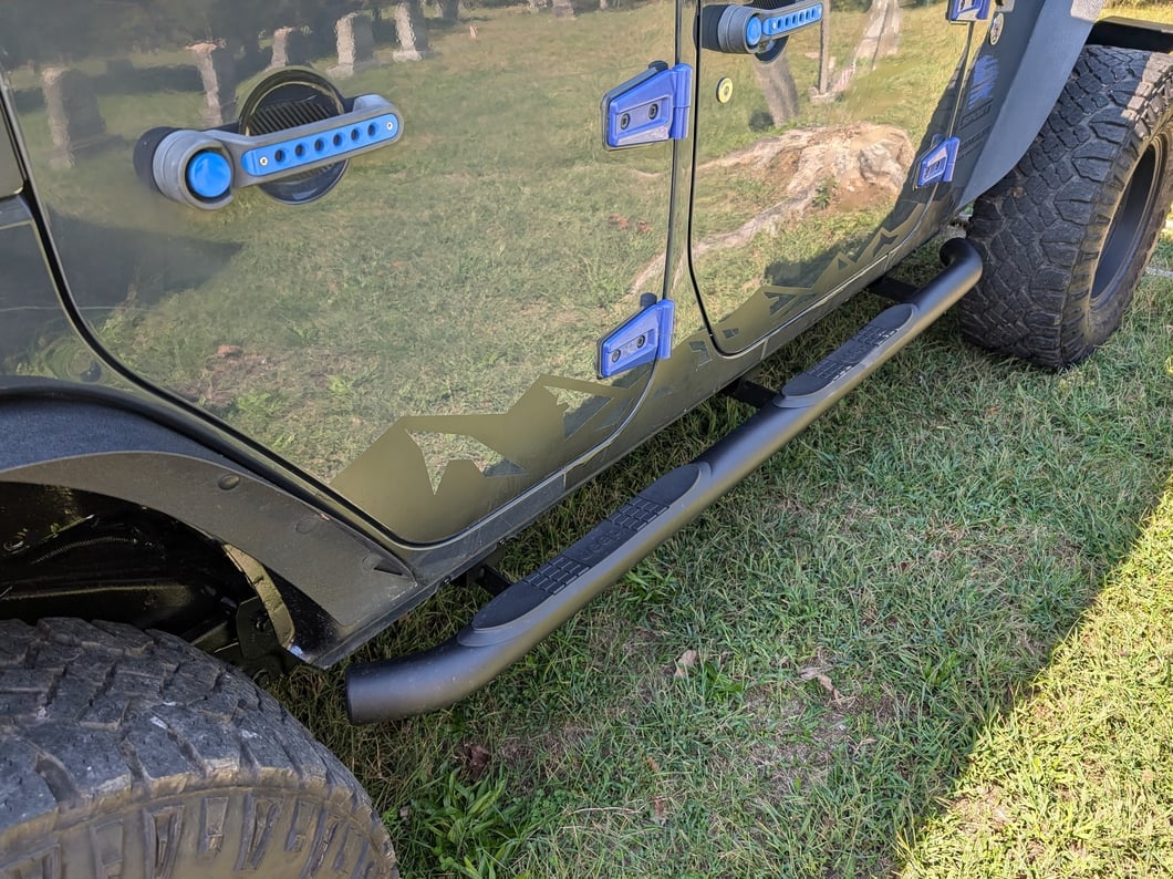 Jeep Licensed by RedRock 3-Inch Round Curved Side Step Bars with Jeep Logo; Textured Black (07-18 Jeep Wrangler JK 4-Door)