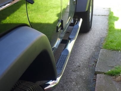 RedRock 3-Inch Round Curved Side Step Bars; Stainless Steel (07-18 Jeep Wrangler JK 4-Door)