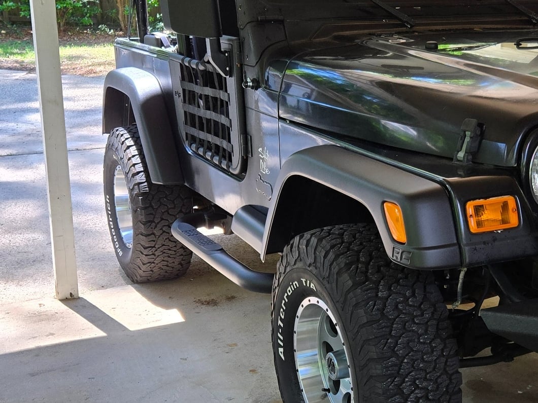 Jeep Licensed by RedRock 3-Inch Round Side Step Bars with Jeep Logo; Textured Black (87-06 Jeep Wrangler YJ & TJ, Excluding Unlimited)